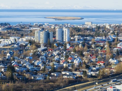 Aerial view of houses and the sea in and around Reykjavík.