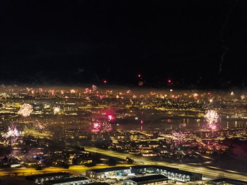 Aerial photo of fireworks over the city.