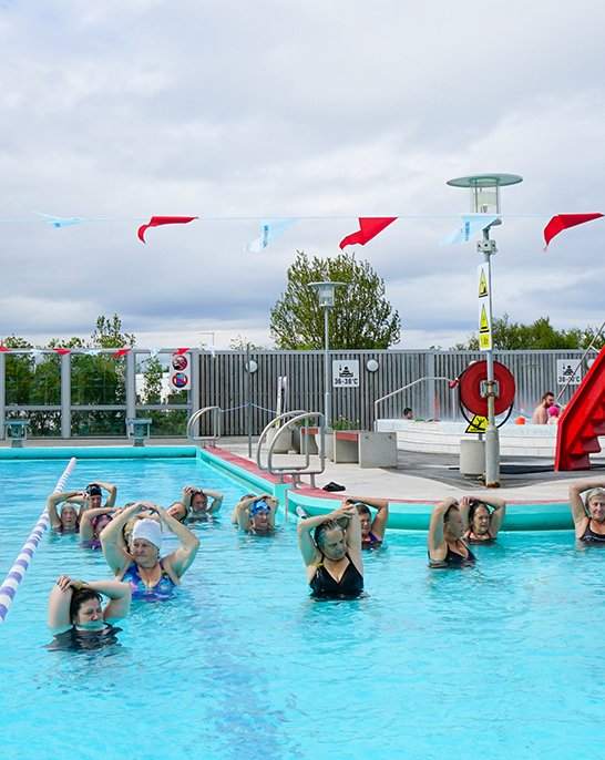 People in water aerobics at Vesturbærjarlaug pool