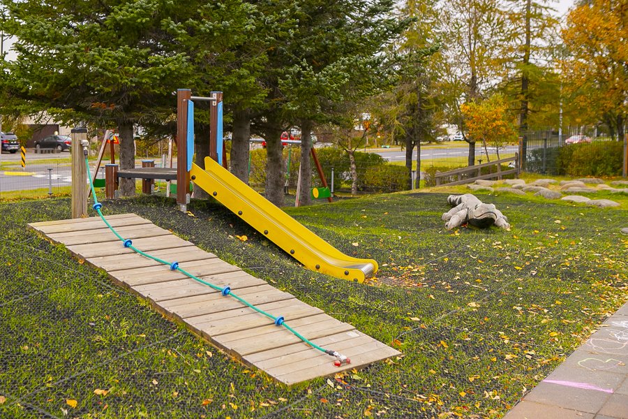 Slide and other playground equipment on the grounds of Bakkaborg.
