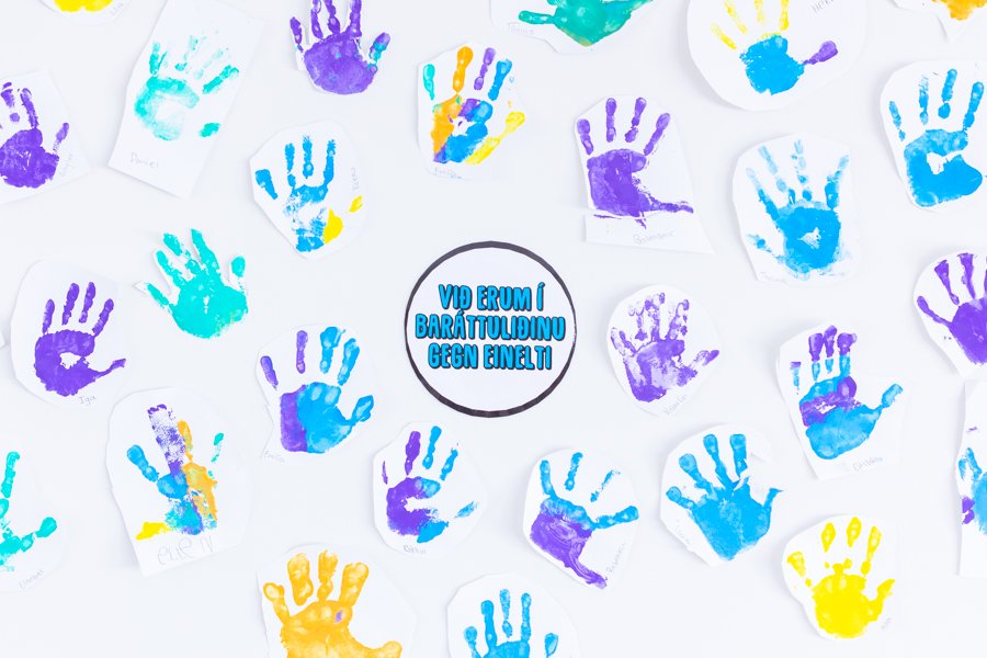 Handprints on the wall and a sign that reads, "We are on the anti-bullying team."
