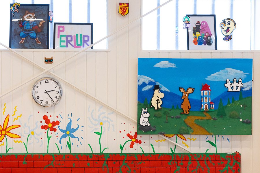 Decorated wall with a clock at the Frostheimar after-school program.