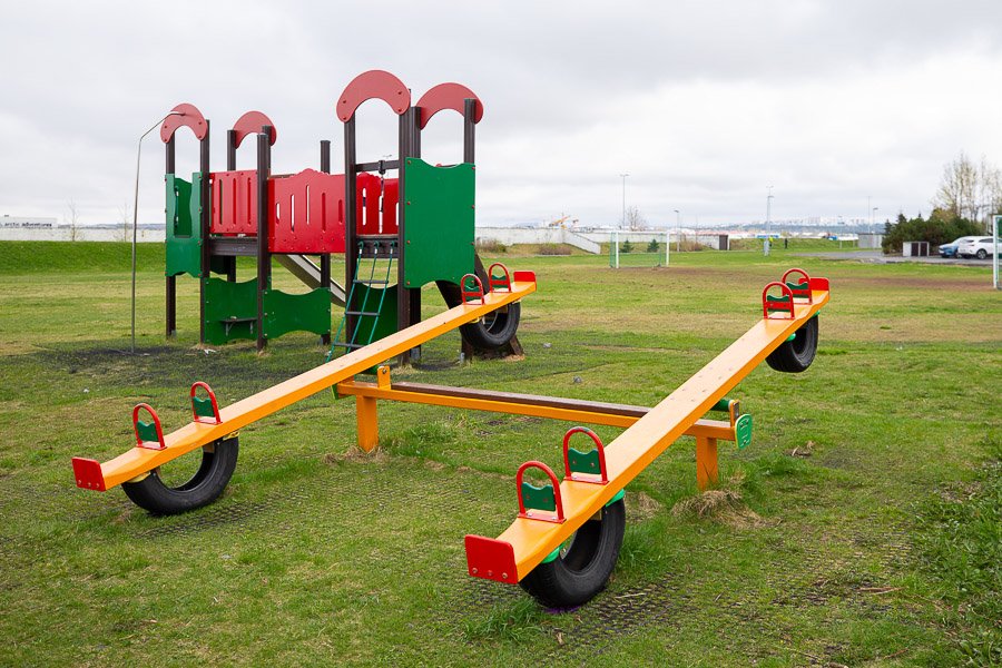 Play area at the Glaðheimar after-school program with road salt and a playground castle.