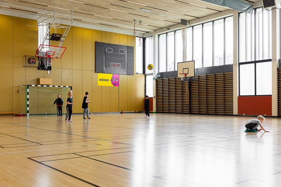 An indoor court in the gymnasium. Children at play.