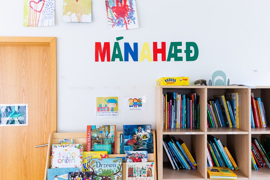 Bookshelves and pictures on the wall at the Halastjarnan after-school program.
