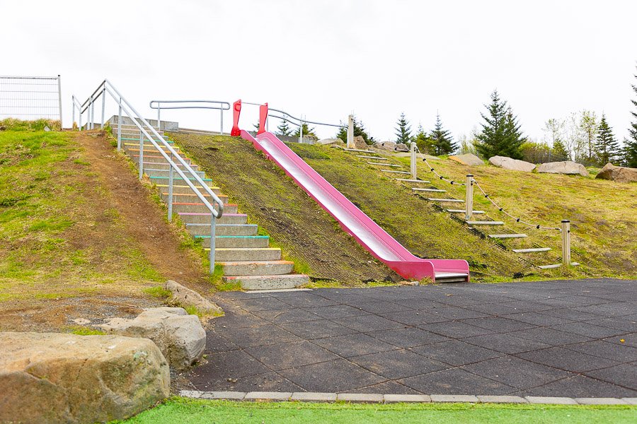 Stairs up a hill and a slide down. 