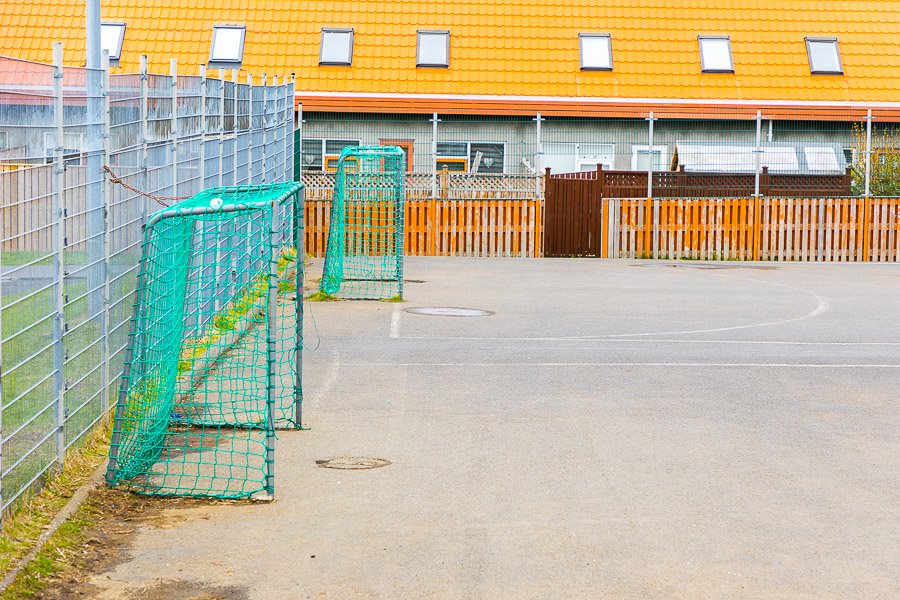 Soccer goals on the school grounds.
