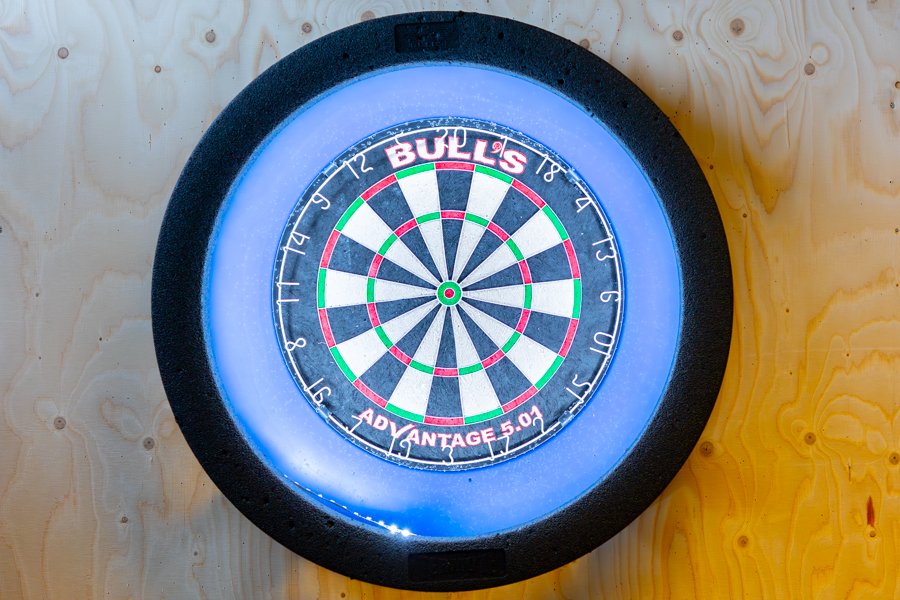 Dartboard mounted on the wall. 