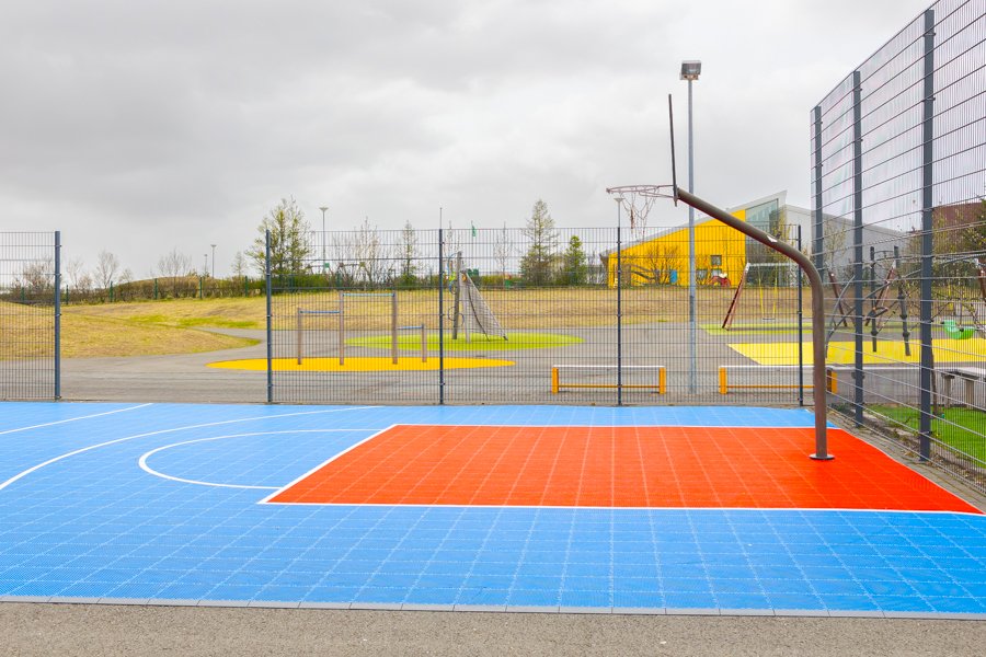 A fenced-in basketball court.