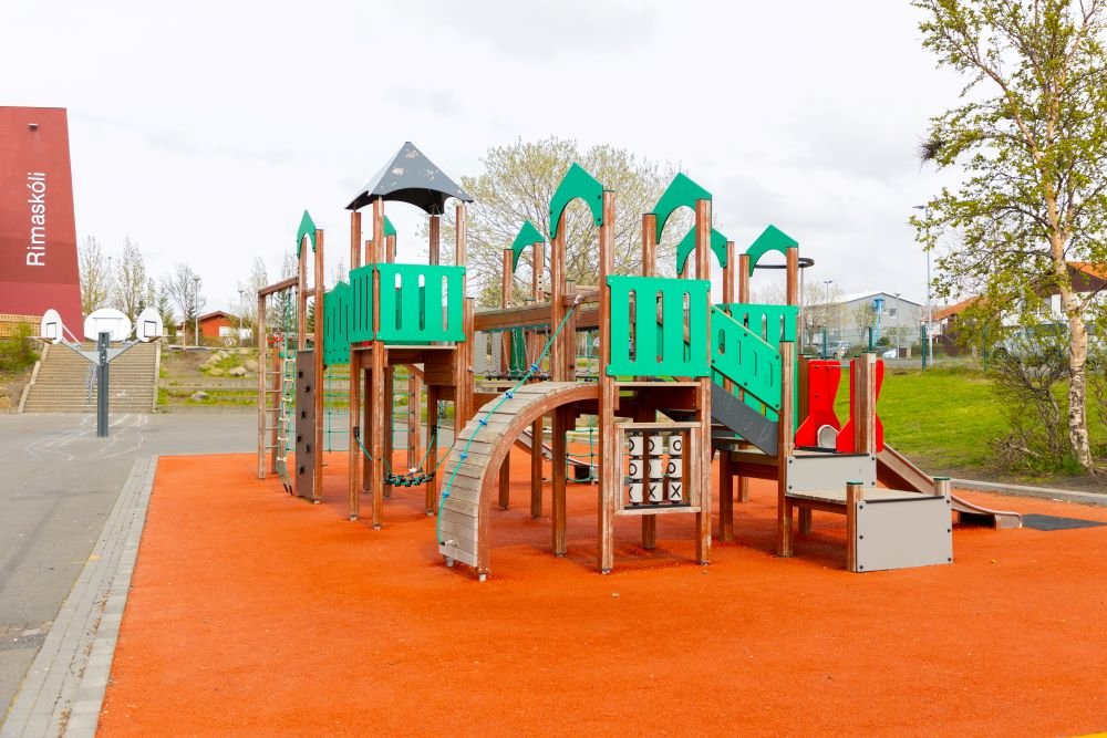 A playground castle on red surface.