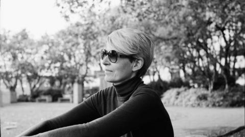 Ellý Katrín wearing sunglasses sitting outdoors